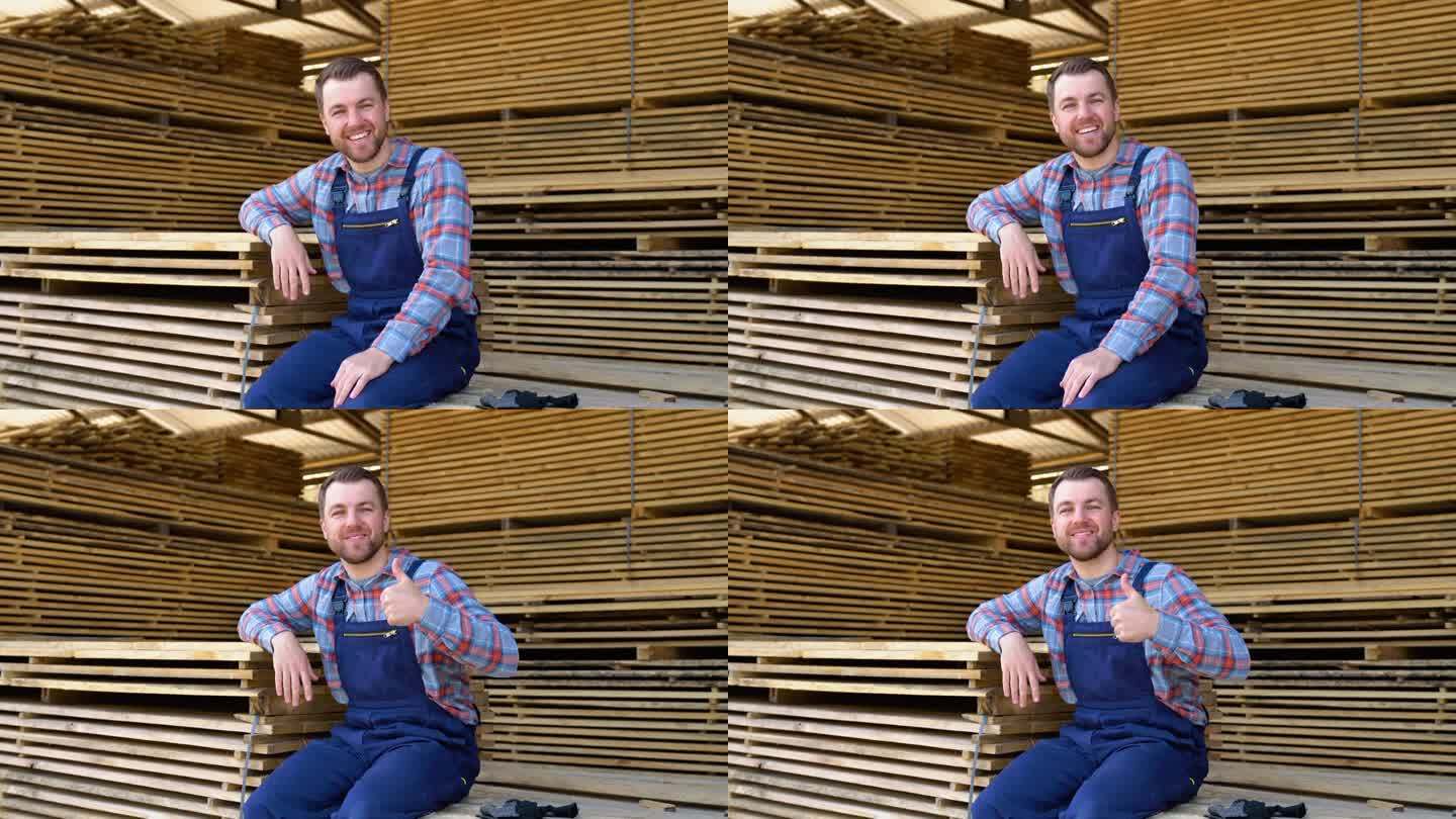 木材仓库的年轻男性工人。概念-木材销售